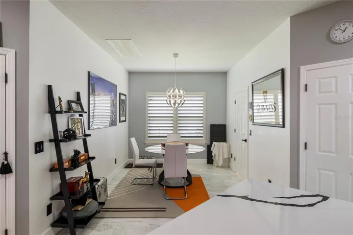 Breakfast nook off of the kitchen, double pantries, access door to laundry room and 3 car garage.