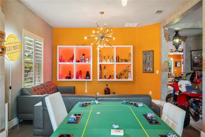 Views of the spacious living and dining rooms featuring bamboo flooring.