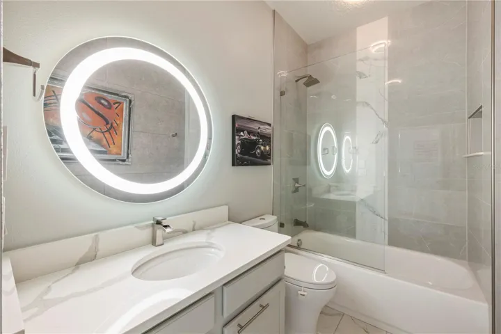 Bathroom 3 - Renovated tile and lighting.