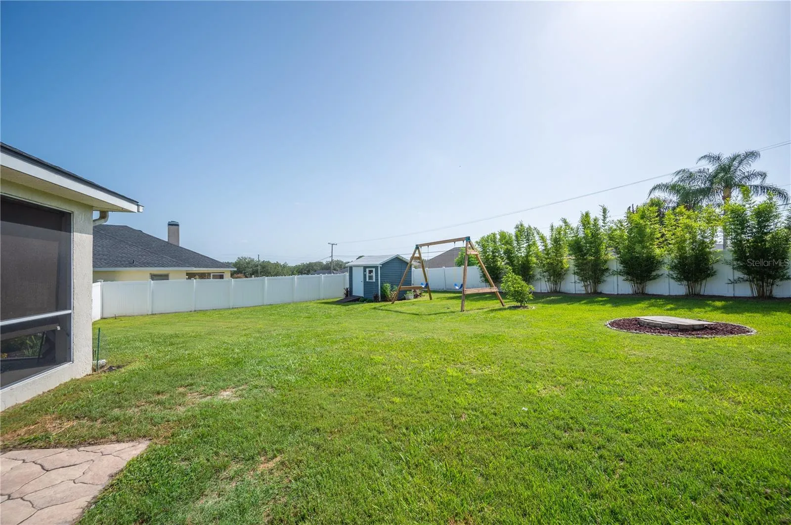 Now this is a yard, beautifully landscaped, clumping bamboo for privacy, swing set and so much more!