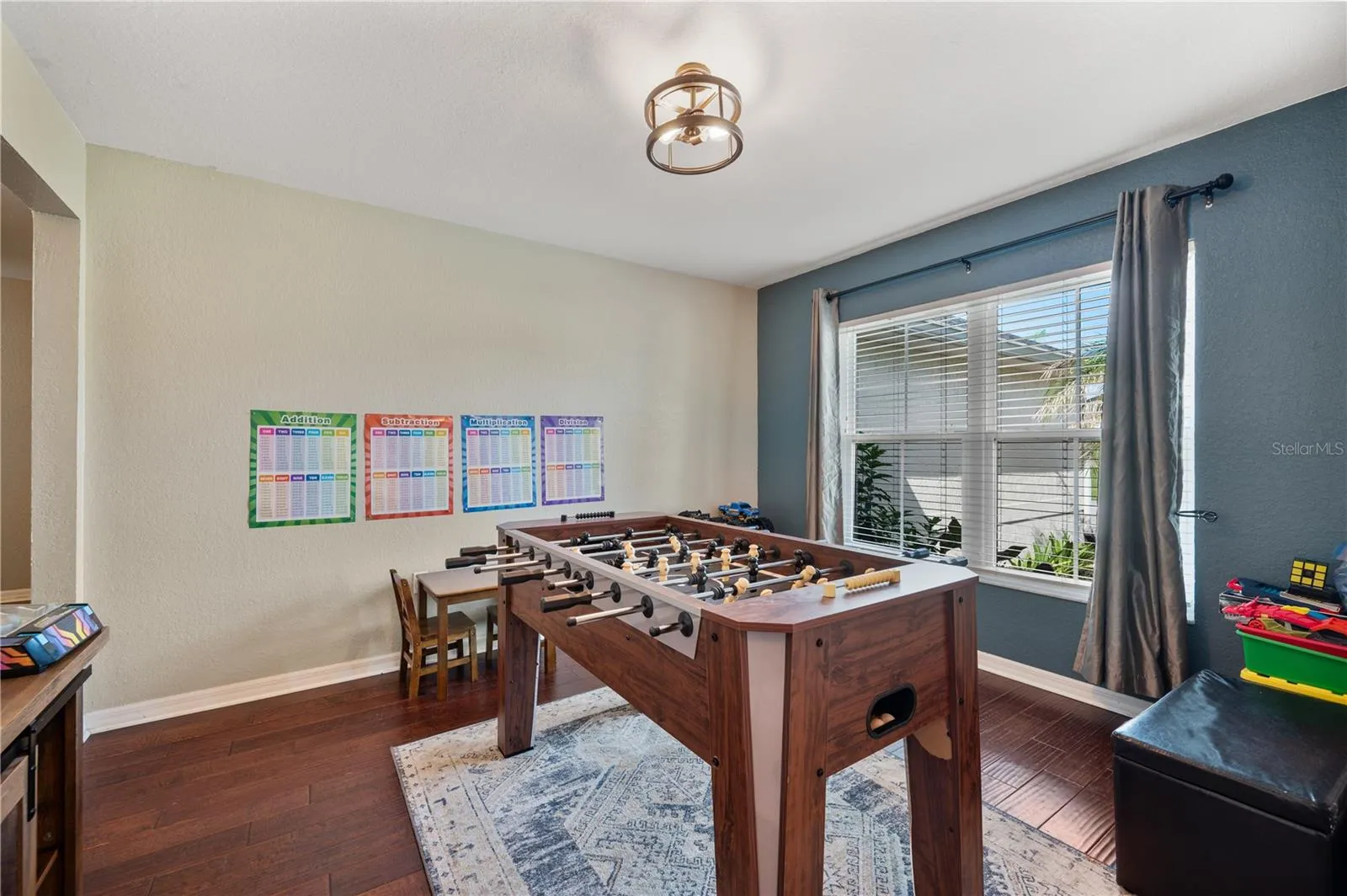 The formal dining room ,is currently being used as a game room.