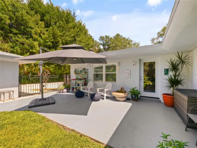 CEMENT PATIO OFF GAME ROOM