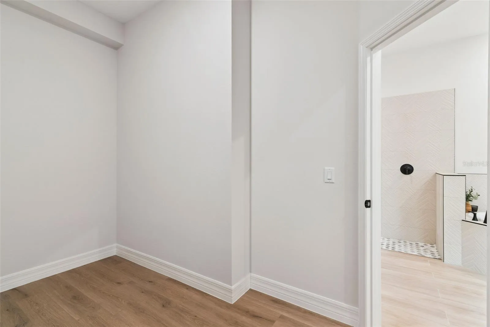 Primary bedroom walk in closet