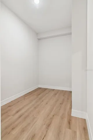 Primary bedroom walk in closet