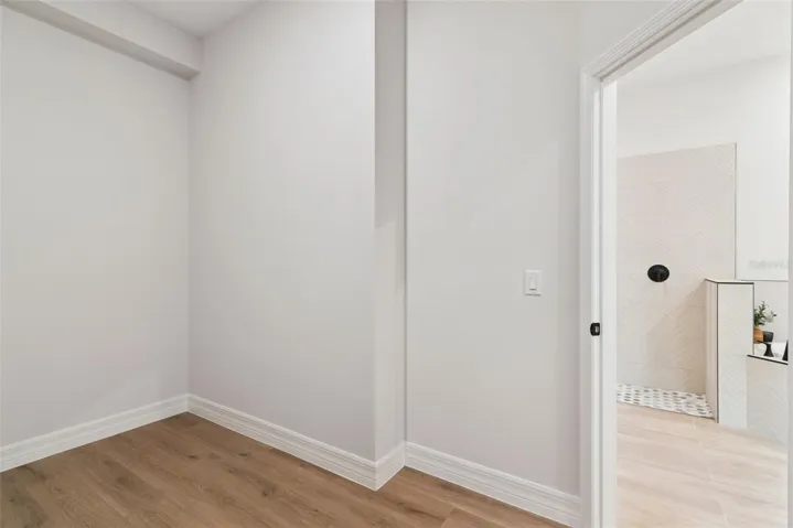 Primary bedroom walk in closet