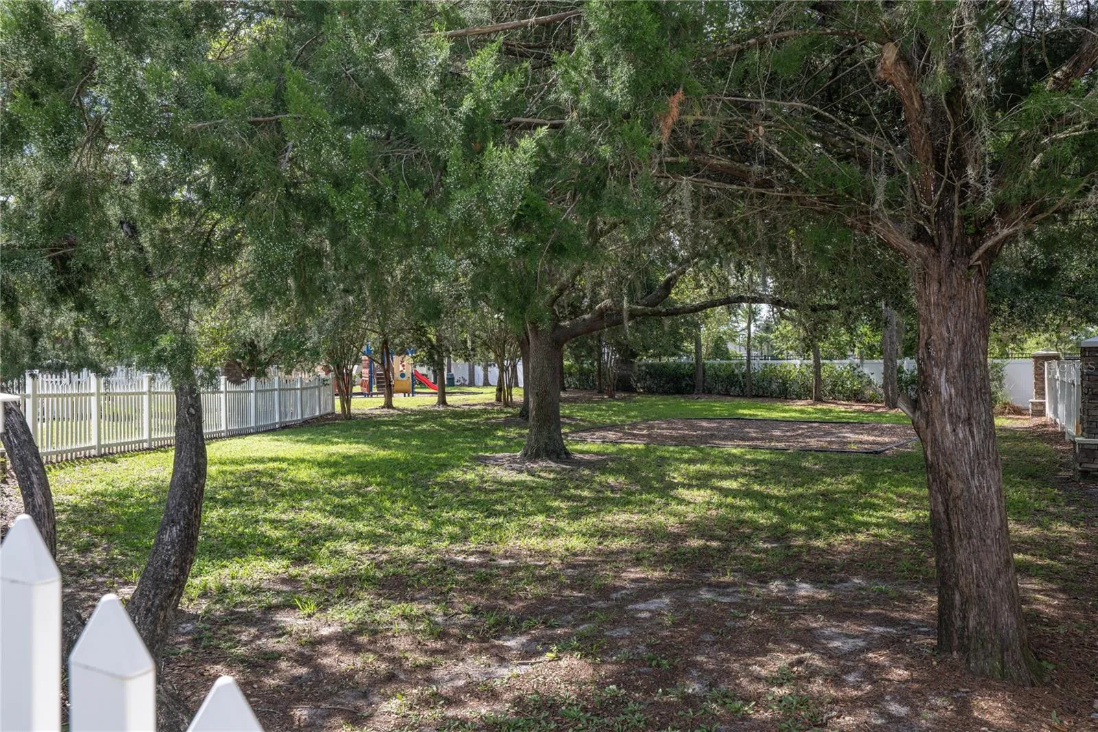 The community dog park offers a spacious fenced area where your furry friends can run, play, and socialize in a safe, shaded setting.