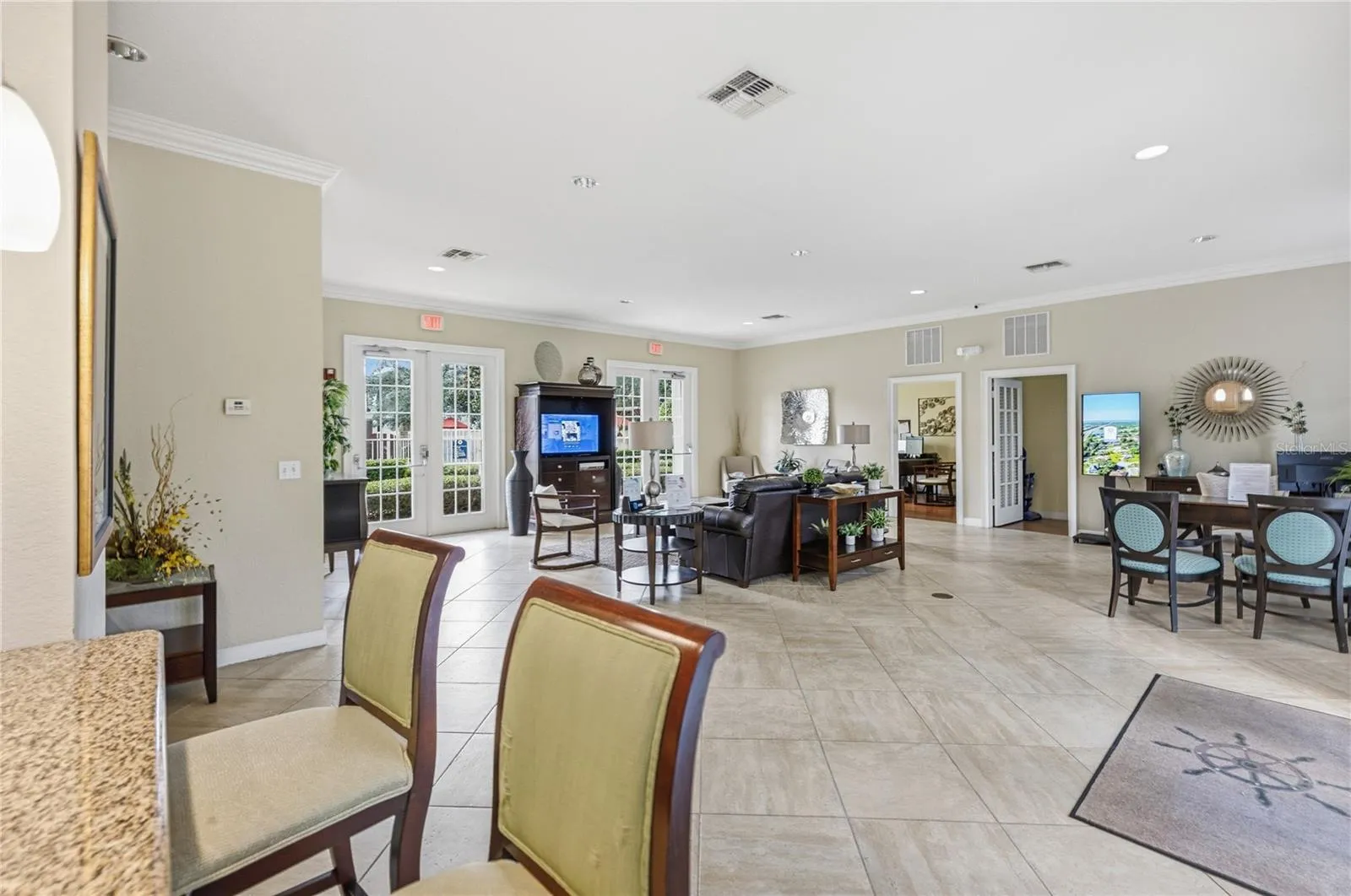 The community clubhouse offers an inviting gathering space with comfortable seating, perfect for meetings, celebrations, or relaxing with neighbors.