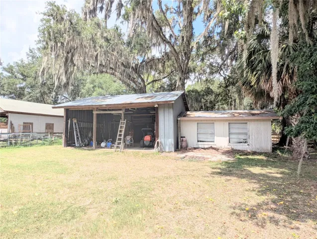 Enclosed pole barn with workshop