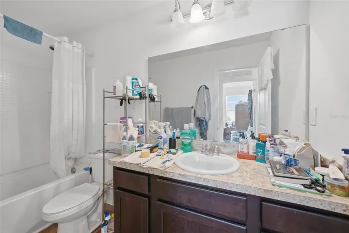 Upstairs full bathroom #2. Seller in process of packing up. This is a short sale.