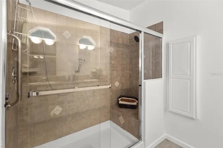 PRIMARY BATHROOM SHOWER WITH BENCH