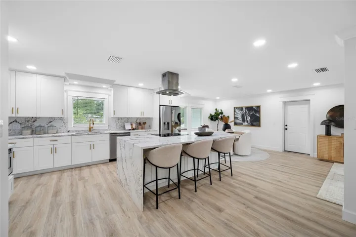 Open-Concept Kitchen with Quartz Island and Seating for Casual Dining