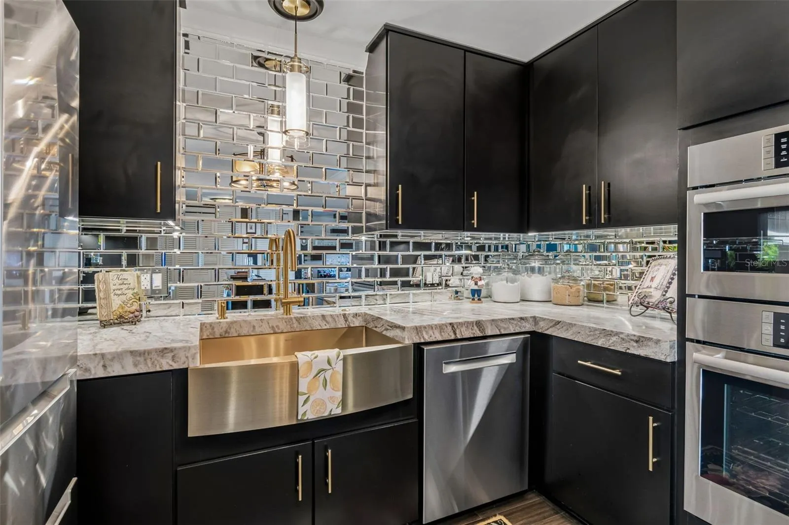 Must see designer touches and details abound, including raised ceilings, brushed gold finishes, Bosch appliance suite, designer lighting!
