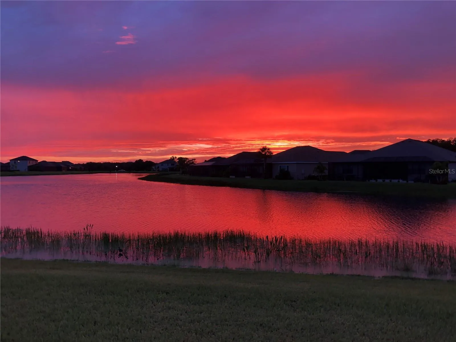 Location Matters!  The back yard view looking west over water.