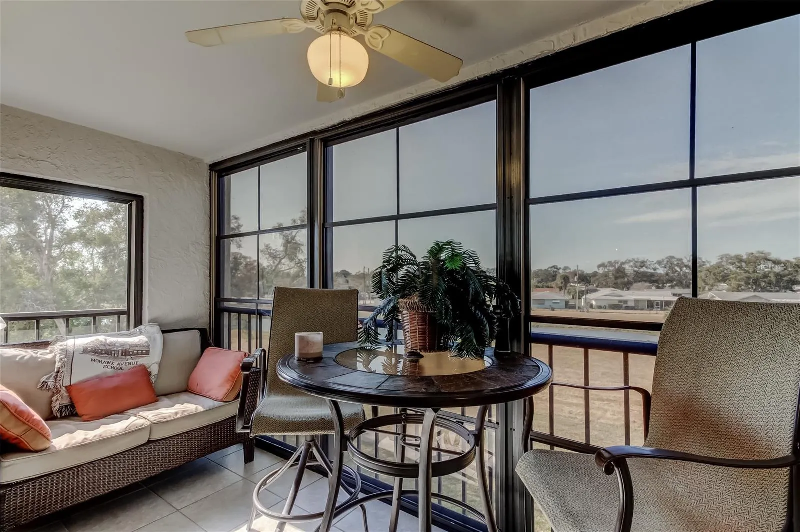 Oversize screened and vinyl window lanai