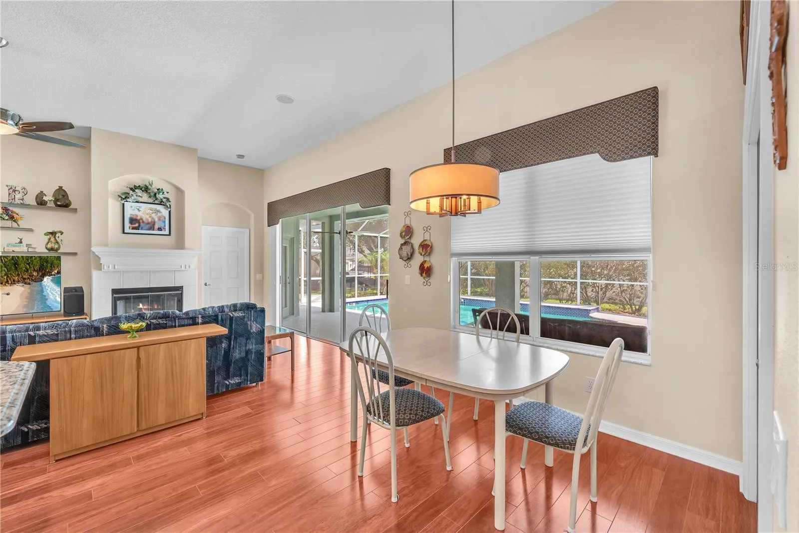 There is a spacious breakfast nook overlooking the pool where family and friends naturally gather.