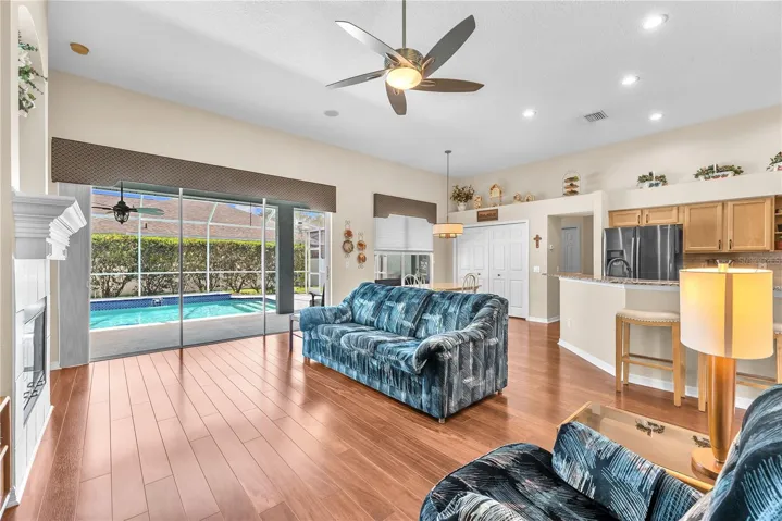 The family room features triple sliding glass doors that fully open to your own private backyard retreat.