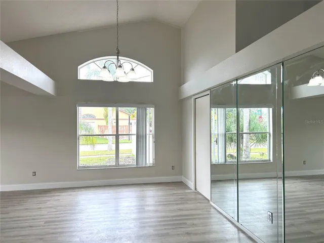 Dining area, new floors, vautlted ceilings