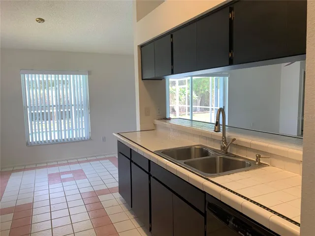 Open galley style kitchen, stainless appliances