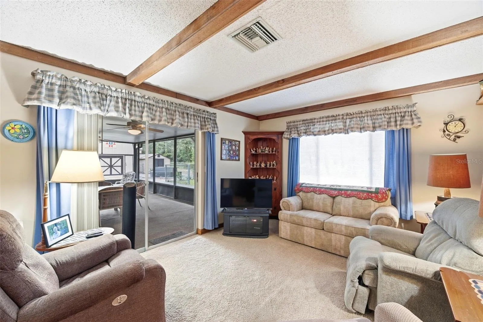 Sliders from living room into screened lanai.