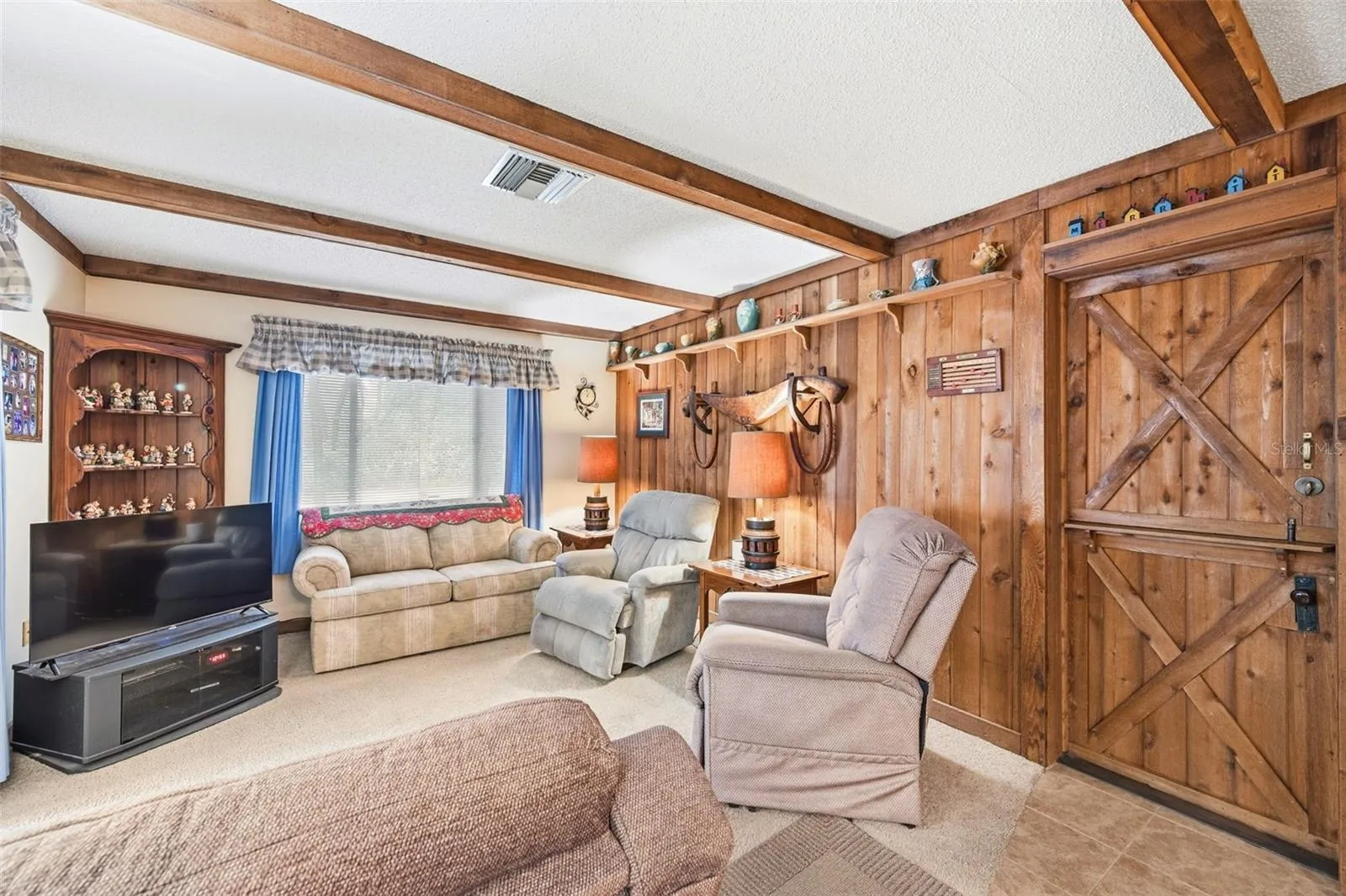 Living room with redwood wall.