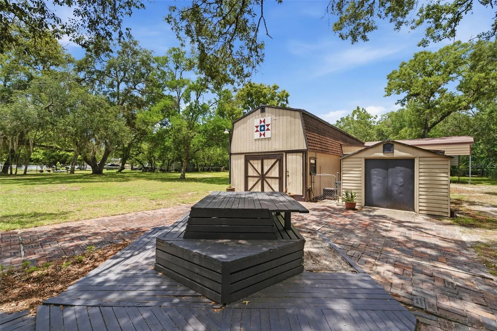 Picnic table & seating on repurposed antique bricks from St. Pete.