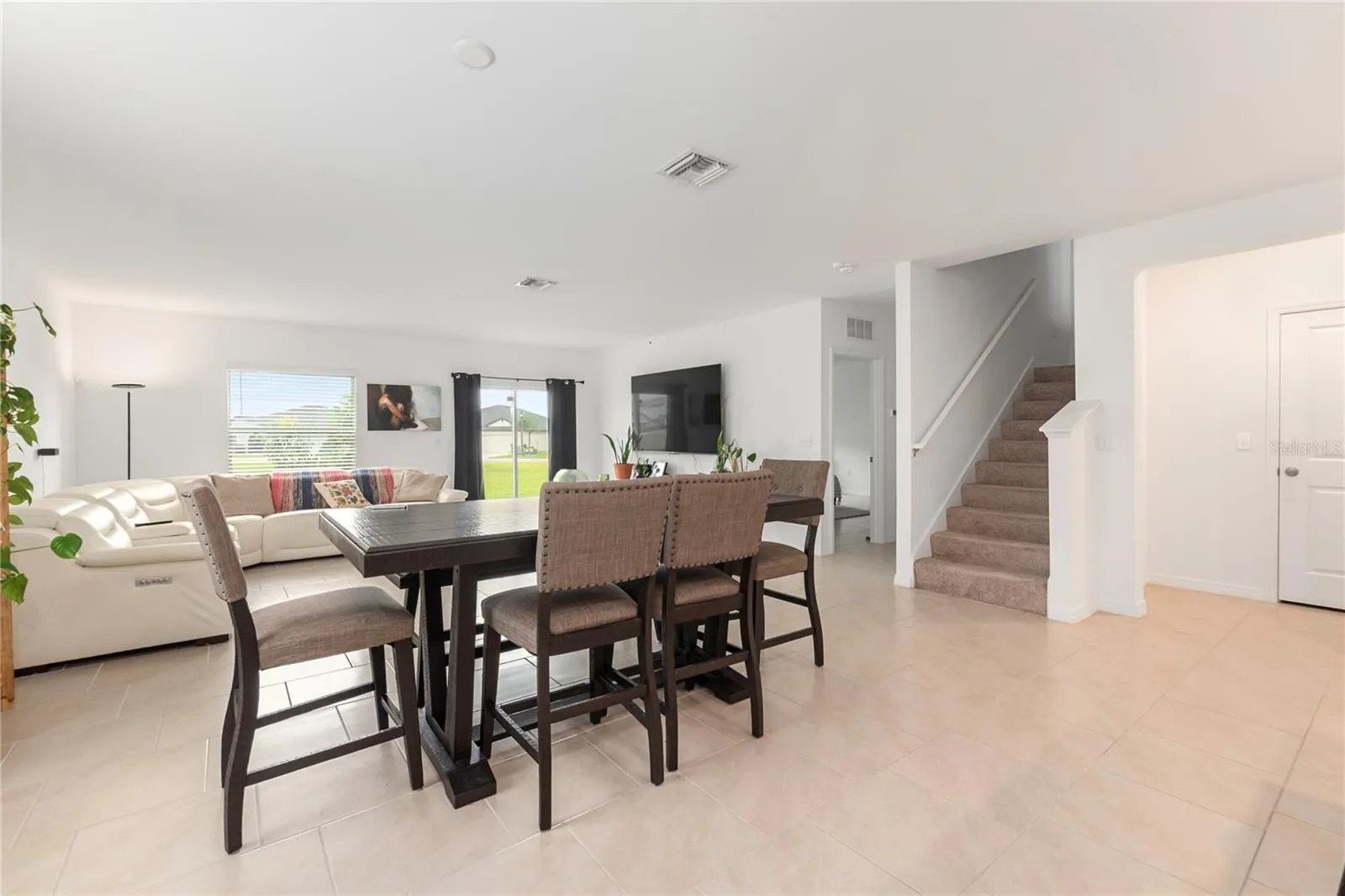 Bright dining space overlooking the backyard, perfect for everyday meals and entertaining guests.