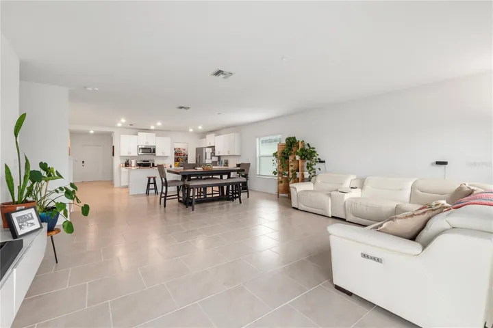 Open-concept great room designed for entertaining with abundant natural light and flexible living space.
