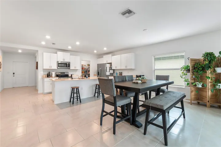 Bright dining space overlooking the backyard, perfect for everyday meals and entertaining guests.