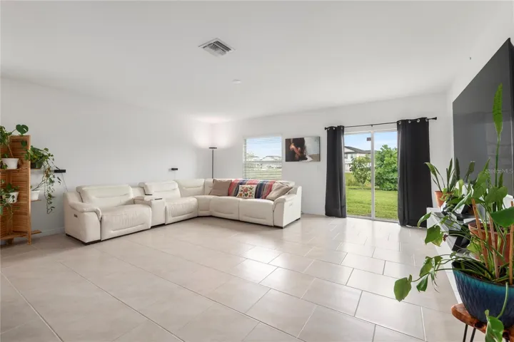 Open-concept great room designed for entertaining with abundant natural light and flexible living space.