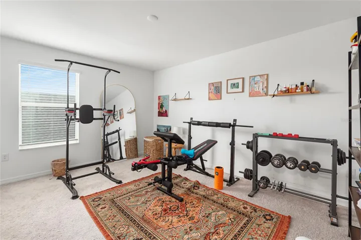 Versatile flex room ideal for a home office, study, craft room, or playroom.