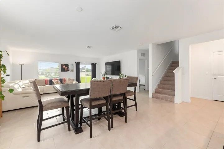 Bright dining space overlooking the backyard, perfect for everyday meals and entertaining guests.