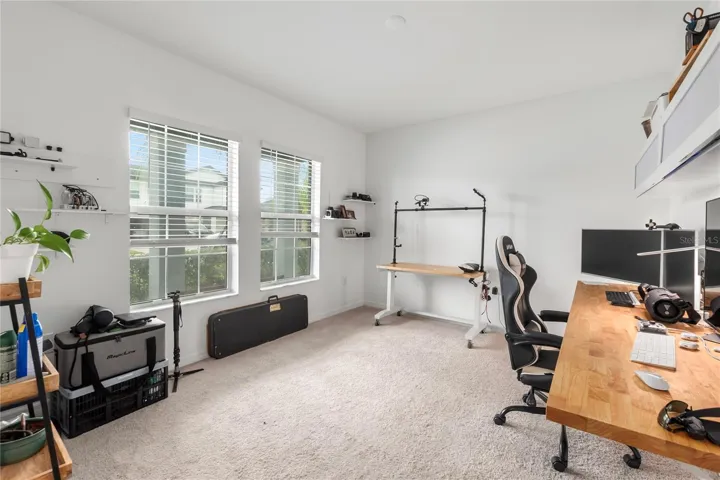 Versatile flex room ideal for a home office, study, craft room, or playroom.