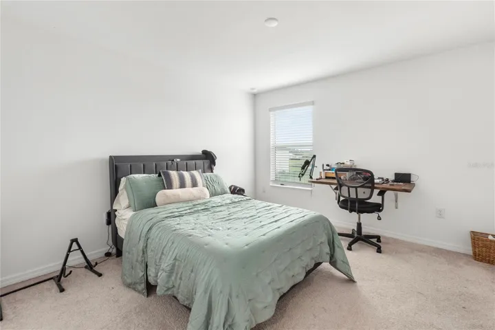 Private guest bedroom ideal for multigenerational living or overnight guests.