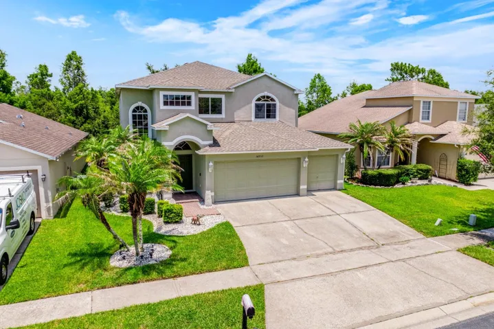 Situated on a premium FENCED ~ CONSERVATION LOT with peaceful WOODED VIEWS, this 3-bedroom, 2.5-bath residence offers modern finishes, multiple outdoor living spaces, and the privacy you have been searching for!