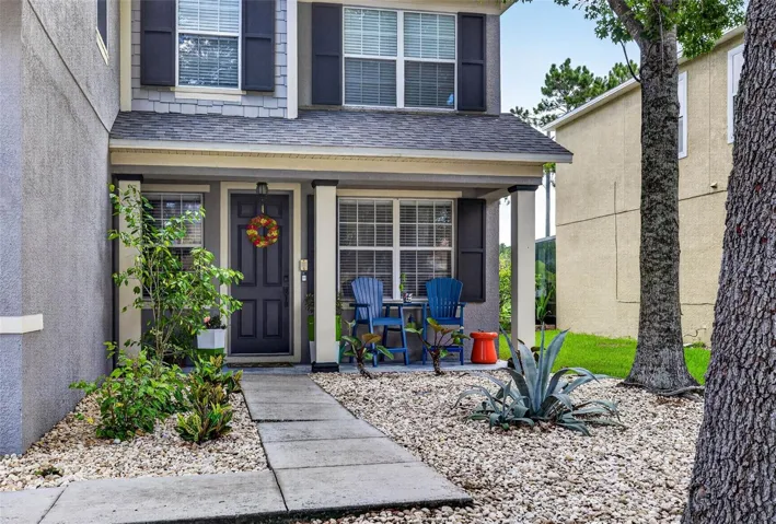 Landscaped front entryway with porch