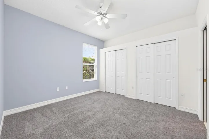 Guest bedroom with en-suite bath access.