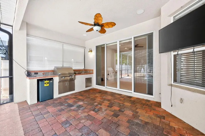 The lanai is complete with an outdoor kitchen.