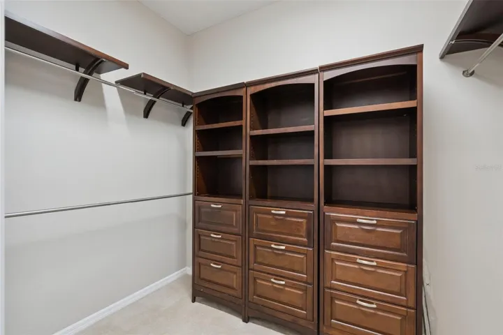 Primary Bedroom Walk-In Closet with Built Ins
