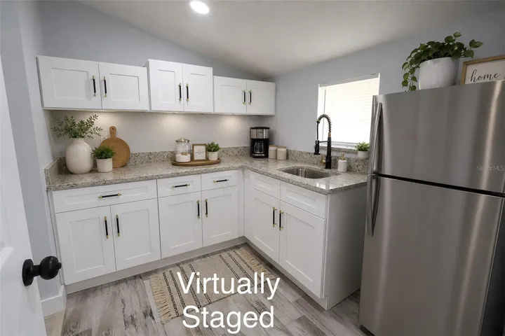 Kitchenette has 2 entry/access doors, one from the master bedroom and the other one leads to the laundry room.