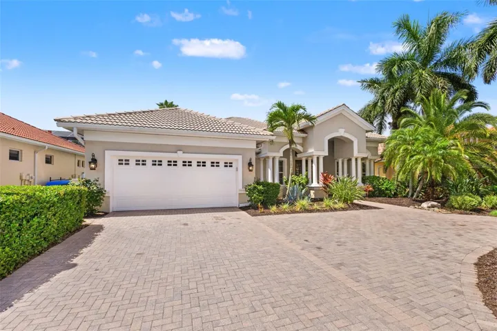 Front elevation with pavered driveway