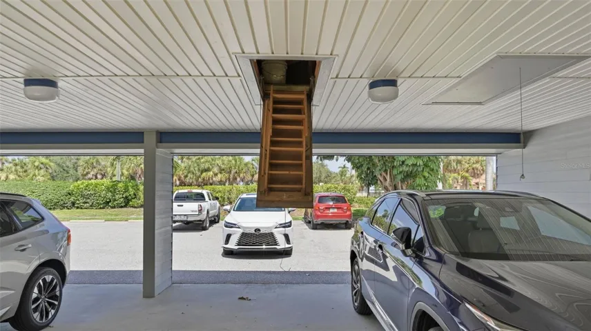 Car port and entry to storage above