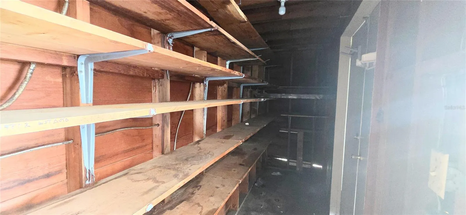Inside storage closet off Carport 1