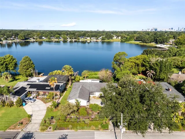 aerial shot of lake and home