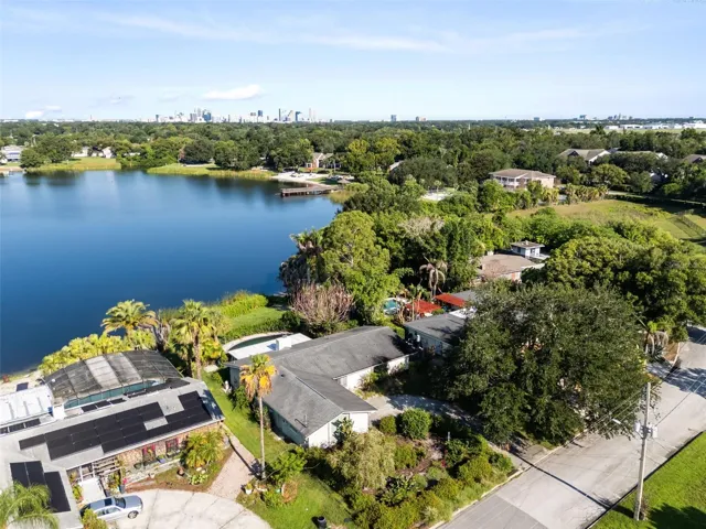 aerial shot of lake and home