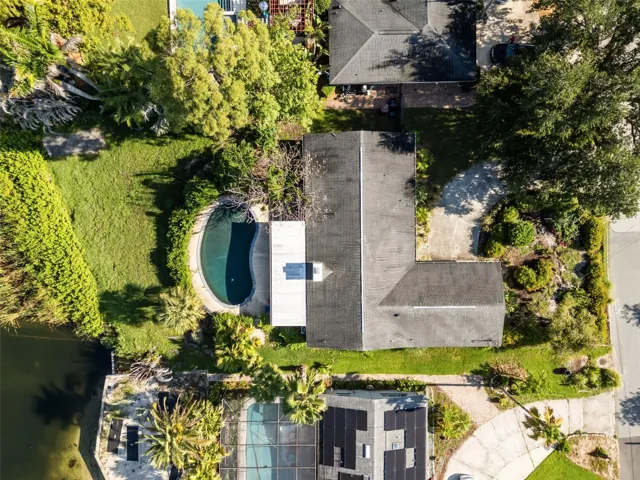 aerial shot of lake and home