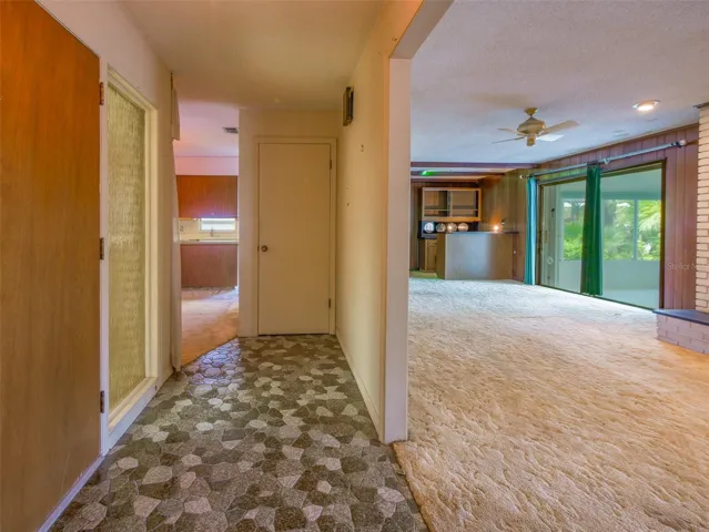 View from the foyer toward the living room and wet bar