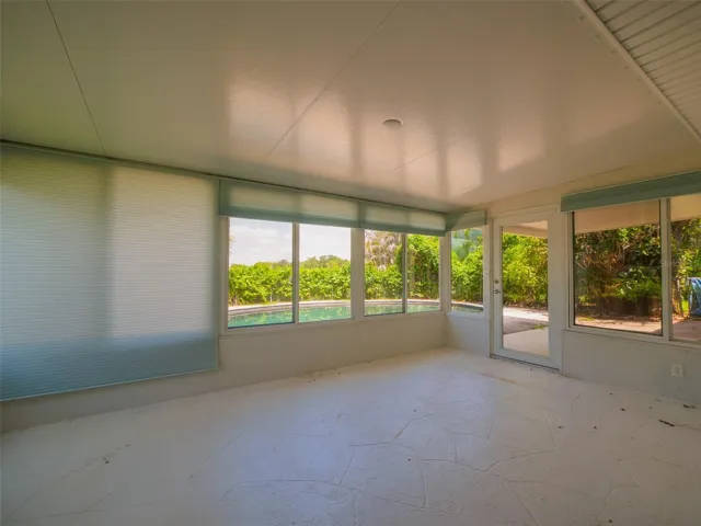 Enclosed florida room overlooking the pool