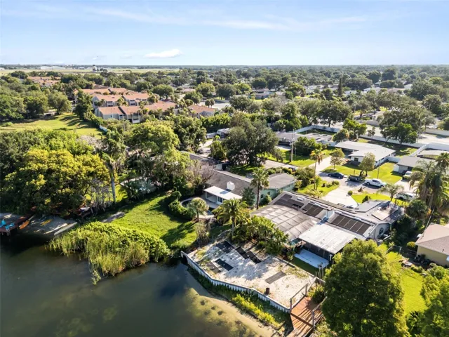aerial shot of lake and home