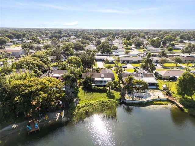 aerial shot of lake and home