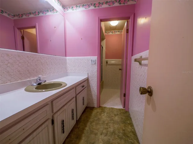 Full bath with extended vanity and tub shower combination